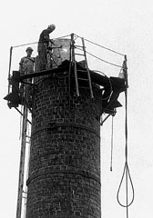 [Photo: the smokestack's final days]