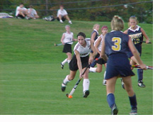 Julia Price '03 drives 
in to score her first career goal